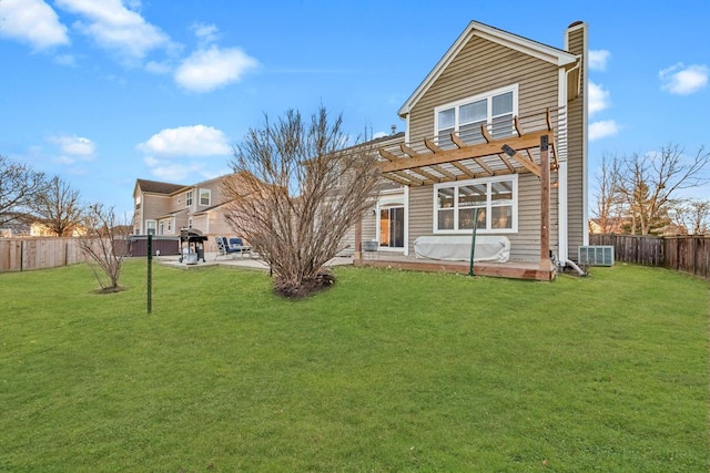 back of property with a fenced backyard, a lawn, a pergola, a chimney, and a patio area