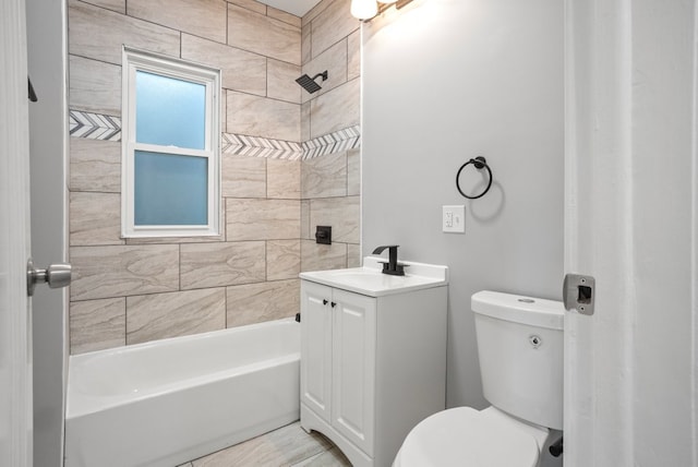 bathroom featuring bathtub / shower combination, vanity, and toilet