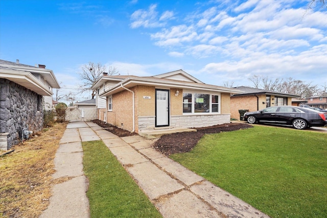 view of front of property featuring stone siding, brick siding, and a front yard