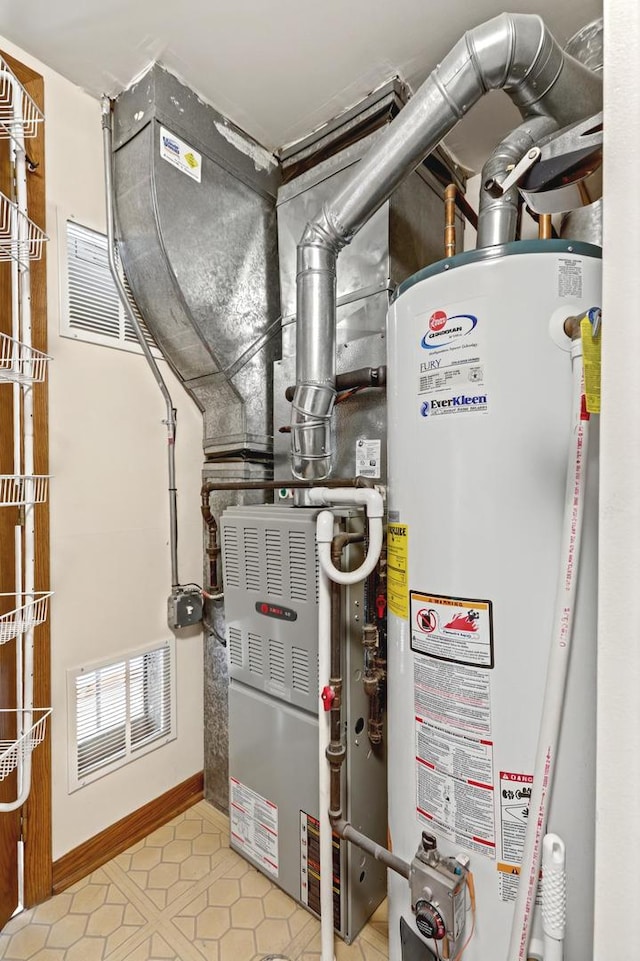 utilities featuring gas water heater and visible vents