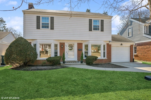 colonial inspired home with brick siding, a chimney, an attached garage, and a front lawn