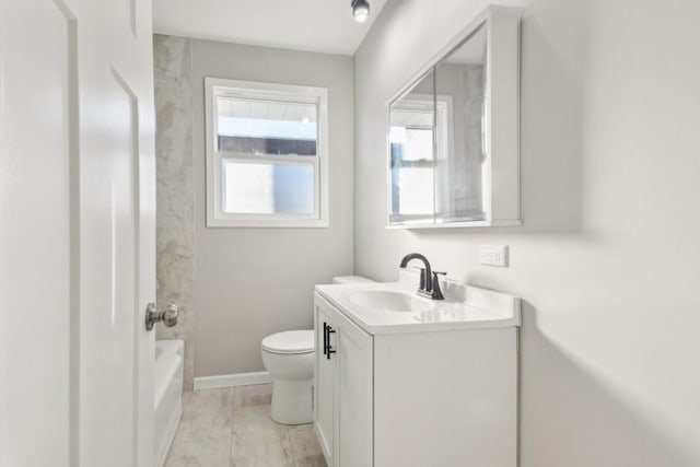 full bathroom featuring toilet, vanity, and baseboards