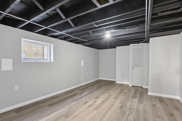 basement with wood finished floors and baseboards