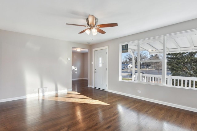 entrance foyer featuring ceiling fan, baseboards, and wood finished floors