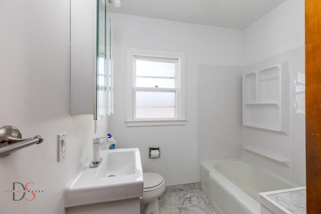 bathroom featuring toilet, marble finish floor, and vanity