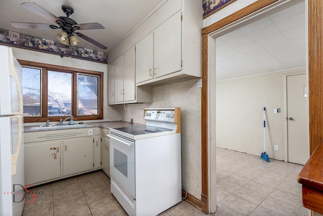 kitchen featuring white appliances, a sink, a ceiling fan, light countertops, and tasteful backsplash