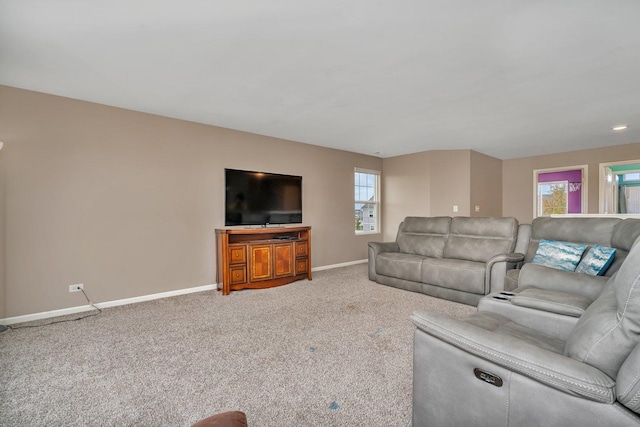 living room featuring carpet floors and baseboards