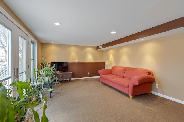 living room featuring carpet, baseboards, and recessed lighting