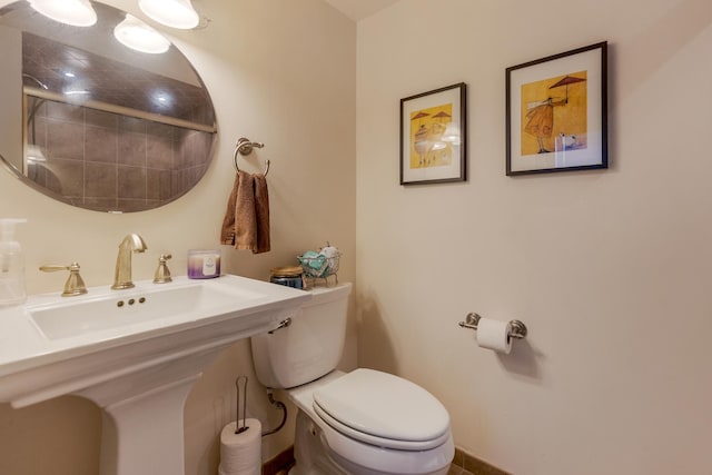 bathroom featuring a sink and toilet