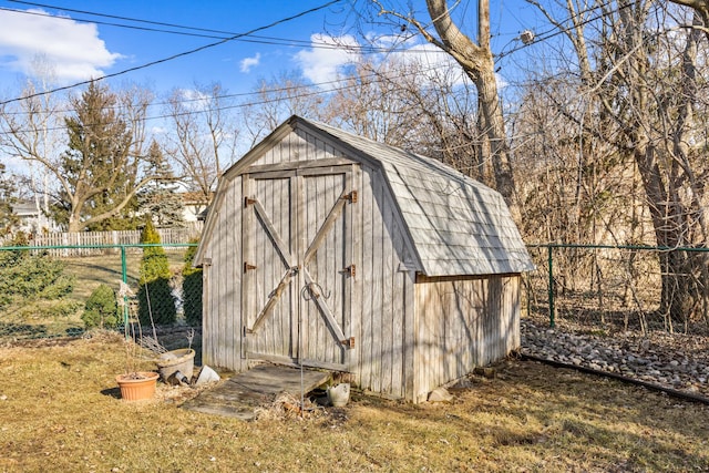 view of shed with a fenced backyard