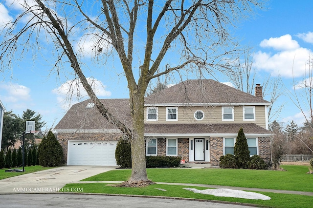 view of front of house featuring a garage, a front yard, brick siding, and a chimney