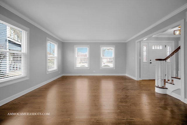 entryway featuring crown molding, stairway, wood finished floors, and baseboards