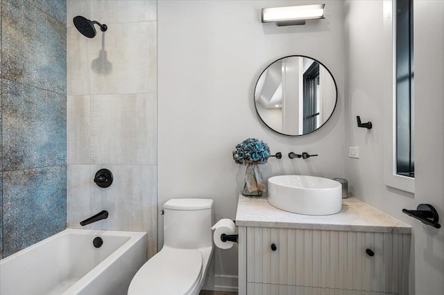 bathroom with  shower combination, vanity, and toilet