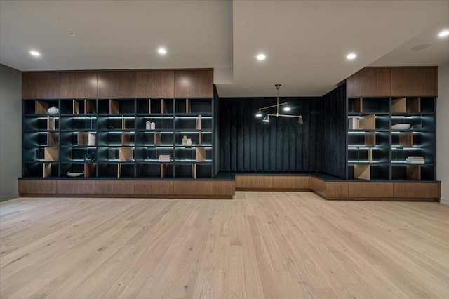 interior space with wood finished floors and recessed lighting