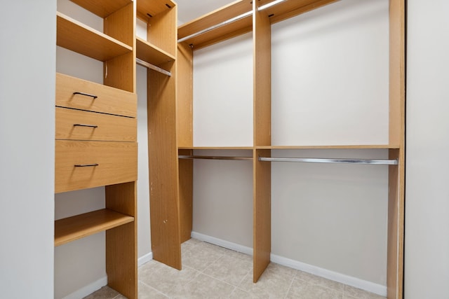 spacious closet with tile patterned flooring