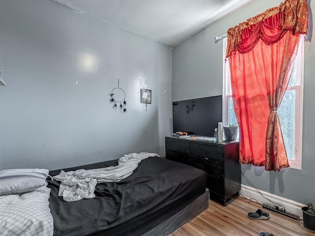 bedroom featuring light wood finished floors