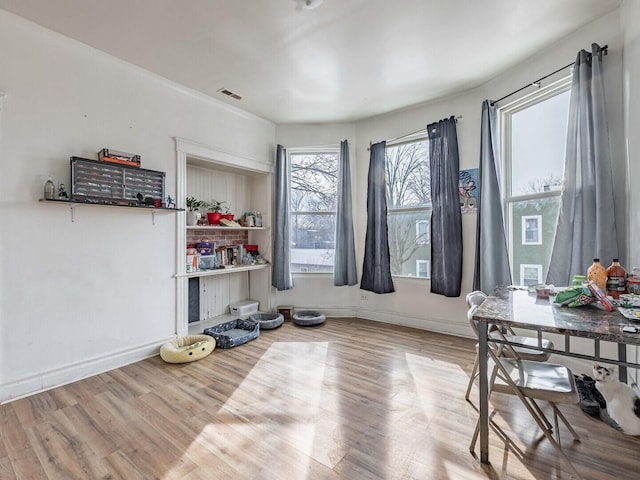 miscellaneous room with visible vents, baseboards, and wood finished floors