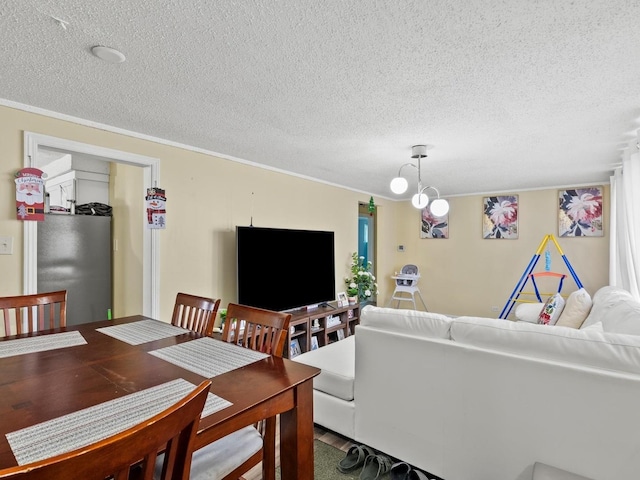 living area with a notable chandelier and a textured ceiling