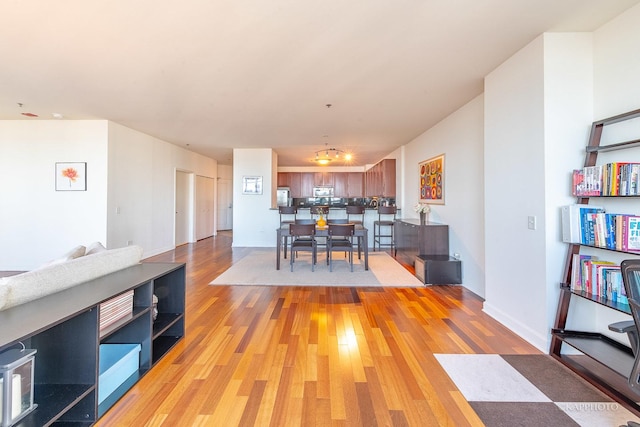 dining area featuring light wood-style flooring