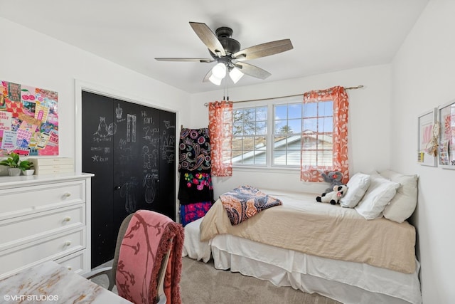 bedroom with ceiling fan and a closet