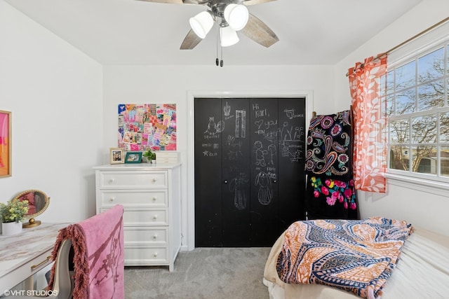 bedroom with carpet floors, ceiling fan, and multiple windows