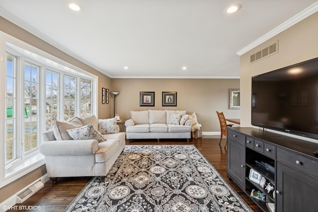 living area with ornamental molding, a wealth of natural light, and visible vents