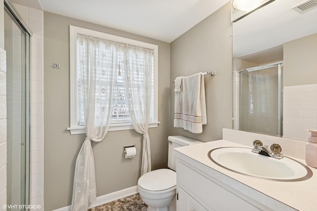 bathroom with toilet, a stall shower, visible vents, and vanity