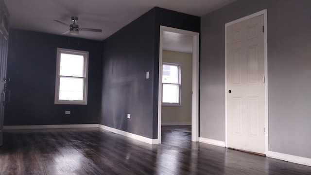 unfurnished bedroom featuring ceiling fan, wood finished floors, and baseboards