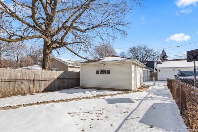 exterior space featuring a garage and fence