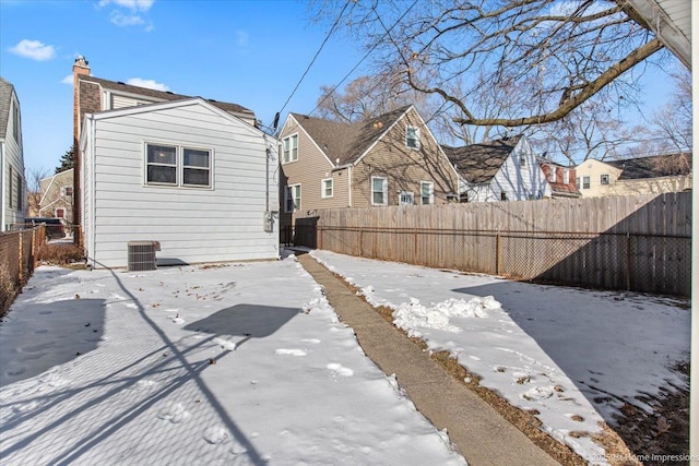 back of property featuring a fenced backyard