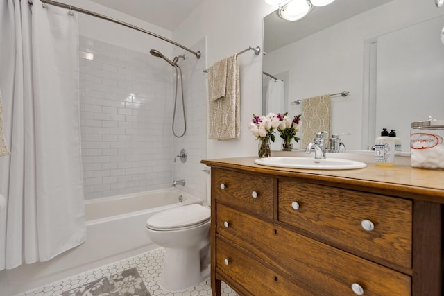 full bathroom featuring vanity, shower / bath combo with shower curtain, toilet, and tile patterned floors