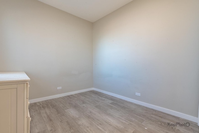 unfurnished room featuring light wood-style floors and baseboards