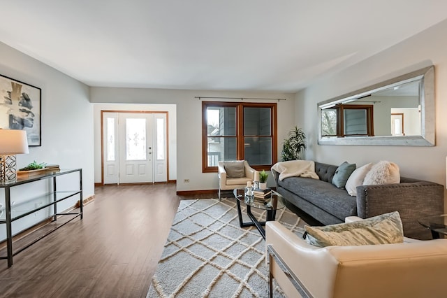 living area featuring wood finished floors and baseboards