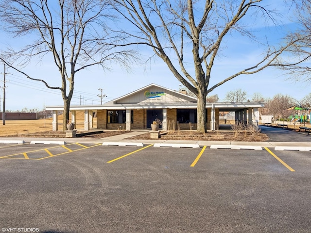 view of property featuring uncovered parking