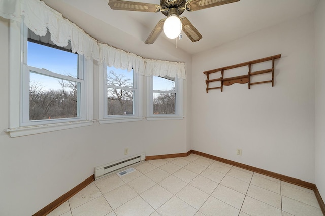 empty room with a baseboard radiator, baseboards, and light tile patterned floors