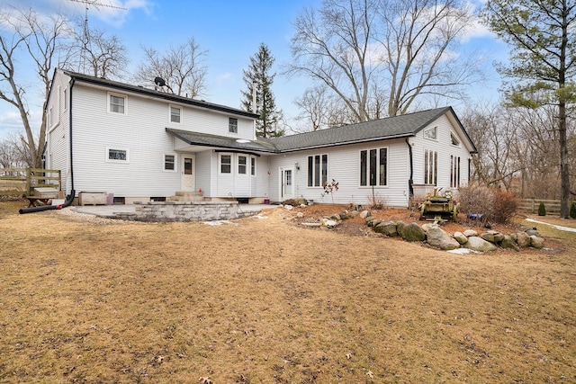 back of property featuring entry steps and a patio area