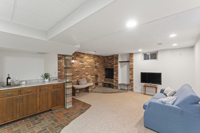 living area featuring a fireplace, dark colored carpet, and recessed lighting