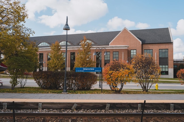 view of building exterior with fence