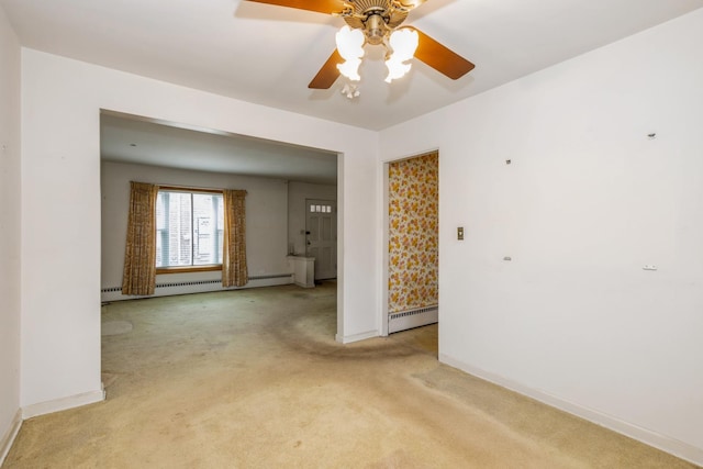 empty room featuring a ceiling fan, a baseboard radiator, light carpet, and baseboards