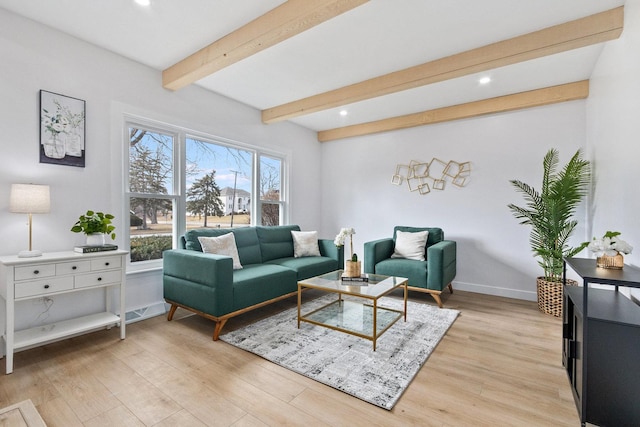 living area with beamed ceiling, recessed lighting, light wood-style flooring, and baseboards