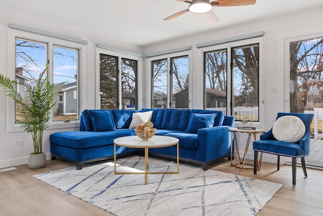 sunroom / solarium with visible vents and ceiling fan