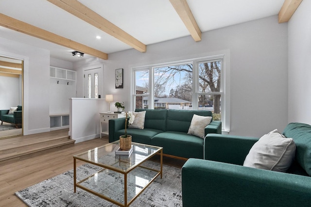 living area with recessed lighting, beamed ceiling, baseboards, and wood finished floors