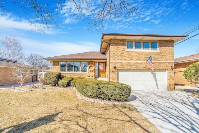 split level home with brick siding, driveway, an attached garage, and a front lawn