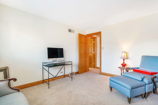 sitting room featuring visible vents, baseboards, and carpet