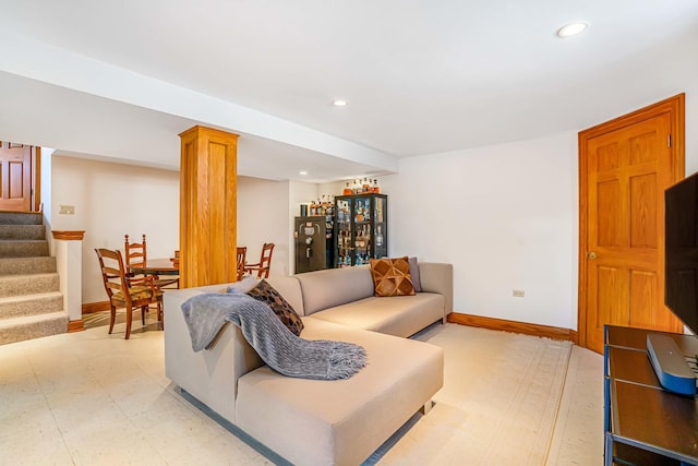 living area with stairway, recessed lighting, baseboards, and light floors