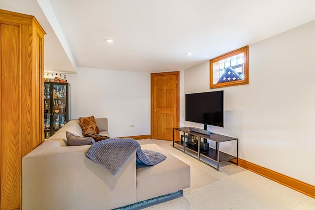 living area featuring tile patterned floors, recessed lighting, and baseboards