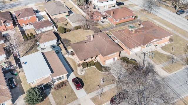 birds eye view of property with a residential view