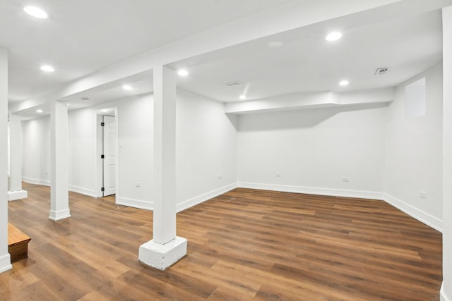 finished basement featuring baseboards, wood finished floors, and recessed lighting