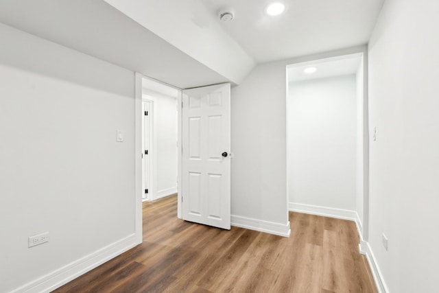 below grade area with wood finished floors and baseboards