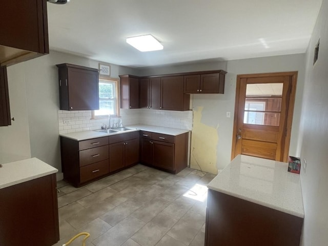 kitchen with backsplash and a sink